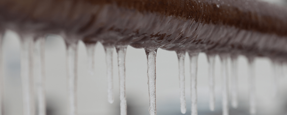 icicles on brown pipe