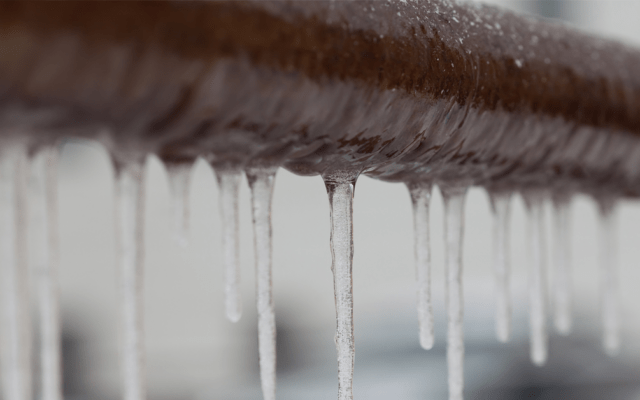 icicles on brown pipe